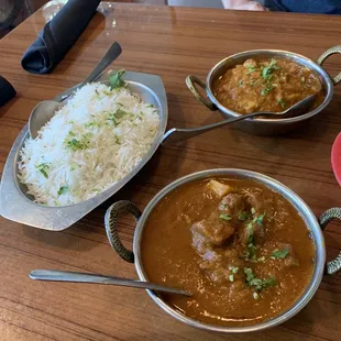 three bowls of curry and rice