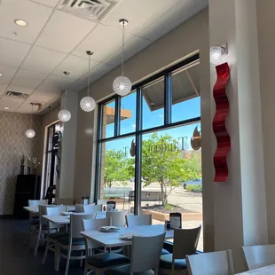 a view of a restaurant with tables and chairs