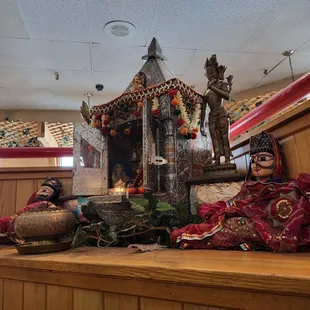 a small shrine in the middle of the restaurant