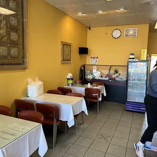 a restaurant with tables and chairs