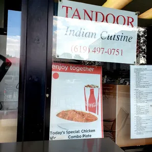 a sign in the window of a restaurant