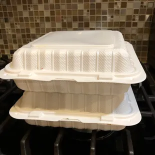 a white container on top of a stove
