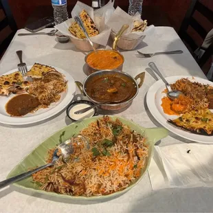 Mutton Biryani, Mutton Curry (Goat), Butter Chicken,Aachari Naan, Garlic Naan, and Samosa 2 Pieces that is not picture.