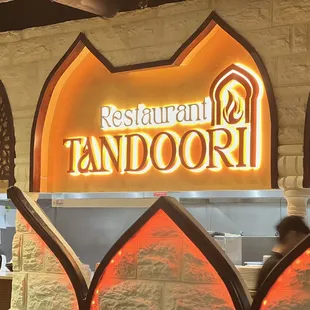 a woman standing in front of a restaurant