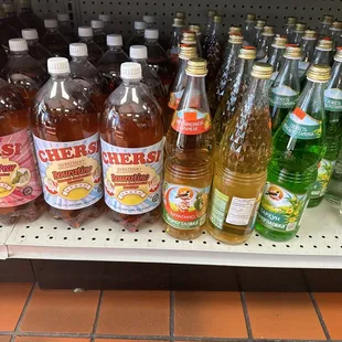 a variety of drinks on a shelf