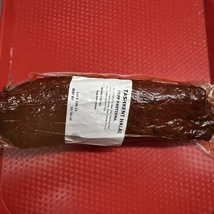 a loaf of bread on a red tray