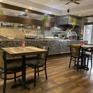 Interior view of steam table area amd some tables.