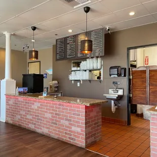 a brick counter in a restaurant