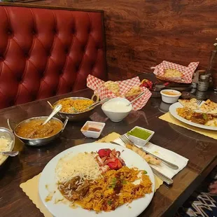 Saffron Rice,Lamb Curry,Goat Biryani,Butter,Garlic &amp; Onion Naan,Tamarind sauce, Mint Jalepeno Chutney,