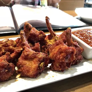 Murgh lollipop -- spicy chicken drumsticks. Delicious! Warning: The chutney is HOT!