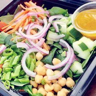 a salad in a plastic container