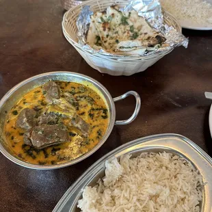 Lamb tika masala and rice . Garlic man  bread - all delicious . Authentic