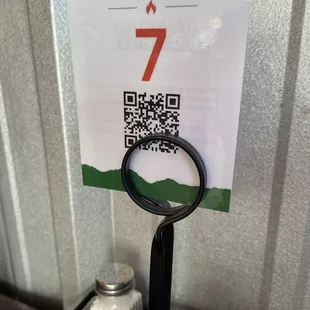 QR code menu doesn't work and isn't scannable in holder if it did