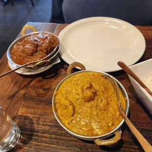 To the left: chicken curry In the front:  lamb pasanda