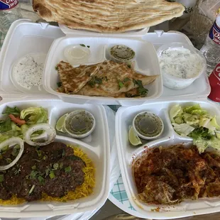 naan on top Middle row: bolani and maste khiar Bottom row: Chapli kabab, mantoo