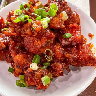 Gobi Manchurian - Fried golden cauliflower flowerets folded in a tangy tomato &amp; garlic sauce. YUM!!
