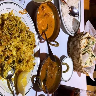 Butter chicken, lamb curry, garlic naan, fish biryani rice, basmati rice