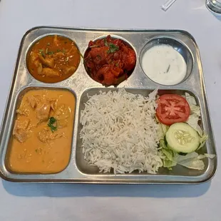 Lunch special. Butter chicken, curry chicken, chili chicken, salad, rice &amp; garlic naan.  So good!