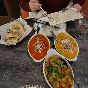 Butter chicken, shahi paneer, aloo gobi.