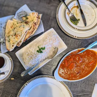 Tikka masala dinner with garlic naan and basmati rice