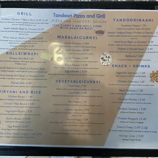 a menu for a tandoori pizza and grill