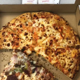 Butter Chicken Pizza and supreme pizza We ordered two small pizzas. Added to me and my husbands list of junk food