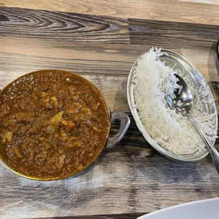 a bowl of curry and a bowl of rice