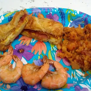 Bacon egg and cheese Croissant with fried potatoes. The shrimp wasn't theirs.