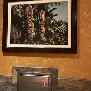 Wall framed painting in the restroom