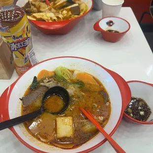 Top: tomato soup  Bottom: spicy hot pot soup