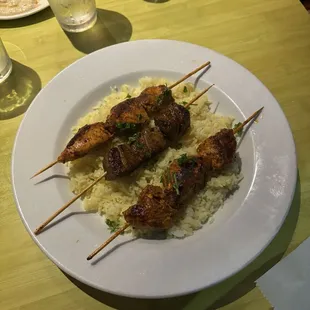 Three kabobs on rice