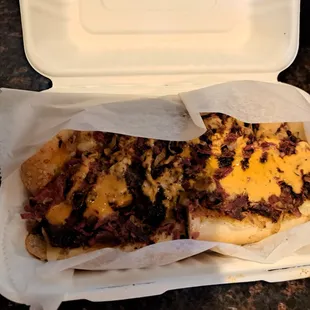 a sandwich in a styrofoam container