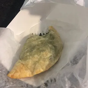 EmpaNONO gross dough mass with internal frozen spinach mass.