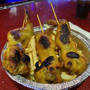 a plate of chicken and french fries