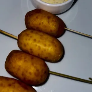 a plate of food with a dipping sauce