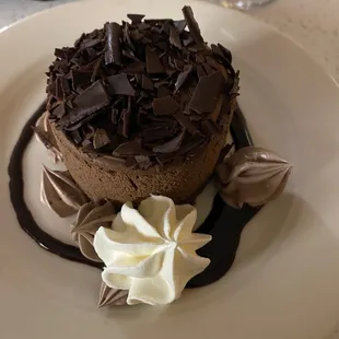 a chocolate cake with whipped cream