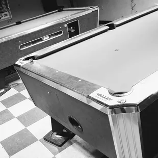a pool table and a game room