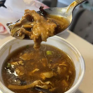 White long hair in my sweet and sour soup.. I have black hair and a hat on !