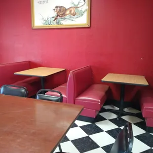 red booths and black and white checkered floor