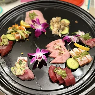 $80 Omakase special on a fancy takeout plate curated by Chef Brandon