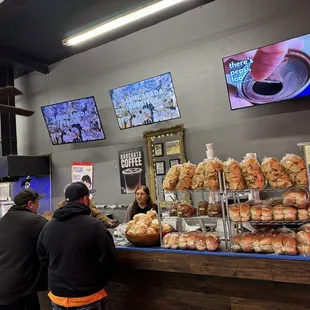 Counter- videos with products. Menu on counter