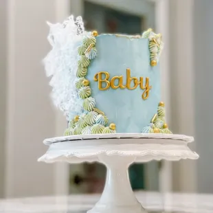 Elegant baby shower cake with wafer paper decorations