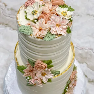 Buttercream florals adorn this elegant 2-tier bridal shower cake