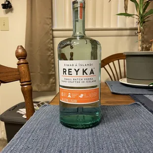 a bottle of reyka on a table