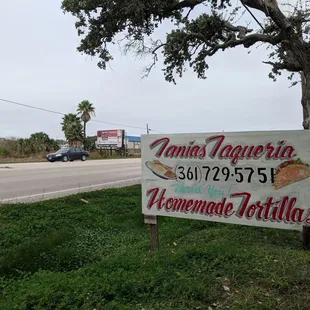 a sign on the side of the road