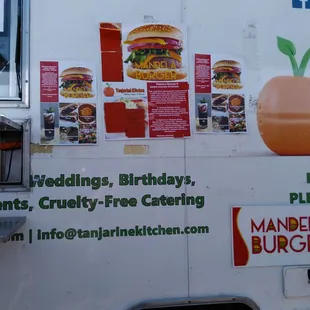 a food truck with menus on it