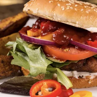 The Mandela Burger, a 100% vegan, hand crafted burger, soy free, high protein, prepared with all organic beans &amp; whole food produce.