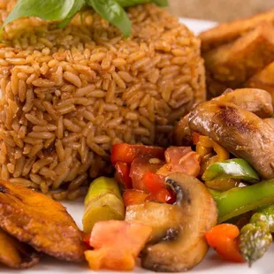 The Marley Jolly rice with veggie stew , fried plantains and tofu- courtesy Tanjariné Kitchen