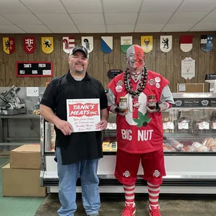 a man and a man dressed as clowns