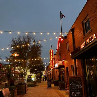 people walking down the sidewalk